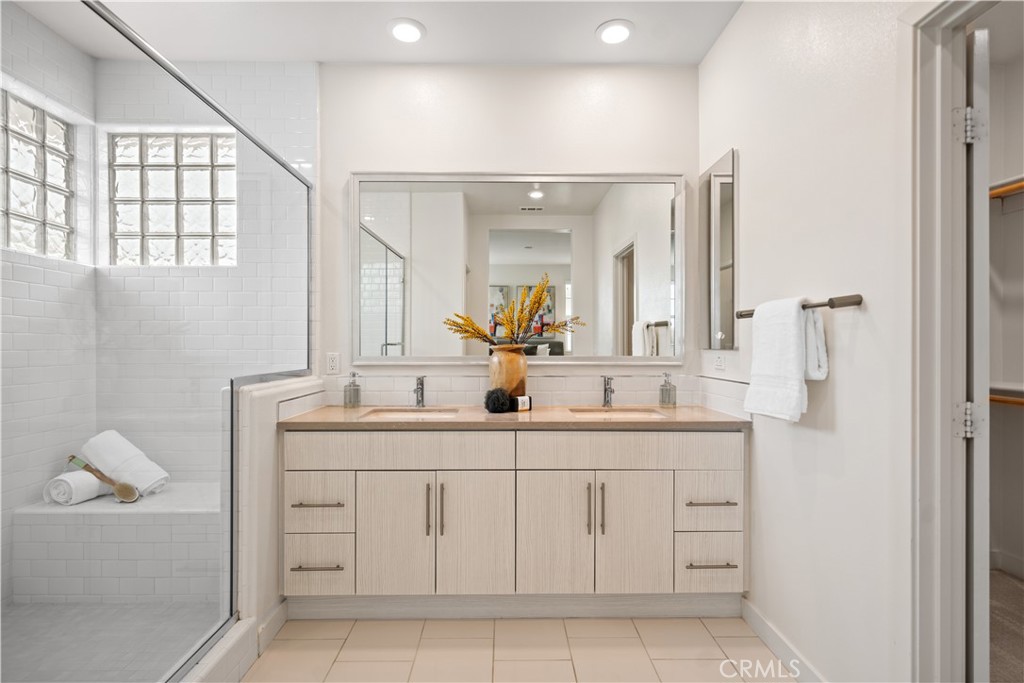 116 Newall Irvine, CA 92618 - Photo 32 of 45 a bathroom with a sink and a mirror