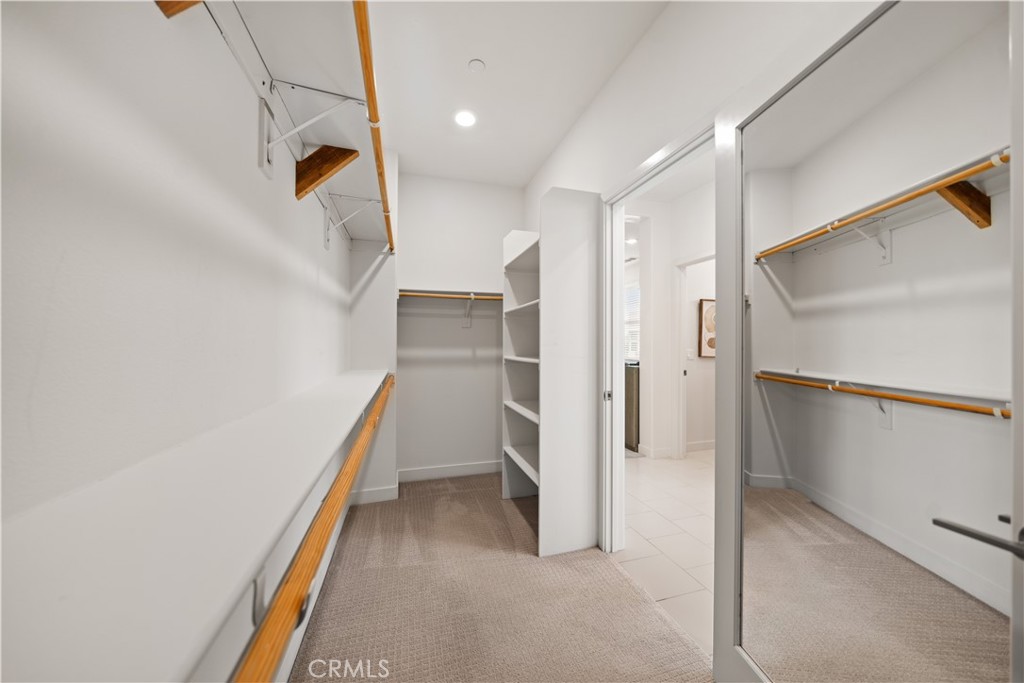 116 Newall Irvine, CA 92618 - Photo 34 of 45 a view of walk in closet with empty racks