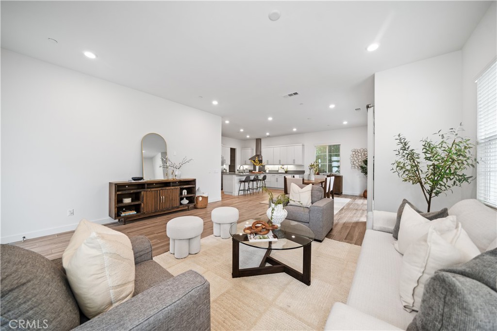 116 Newall Irvine, CA 92618 - Photo 5 of 45 a living room with furniture and kitchen view