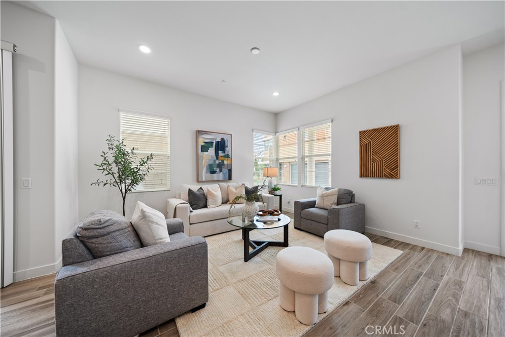 116 Newall Irvine, CA 92618 - Photo 6 of 45 a living room with furniture and a wooden floor