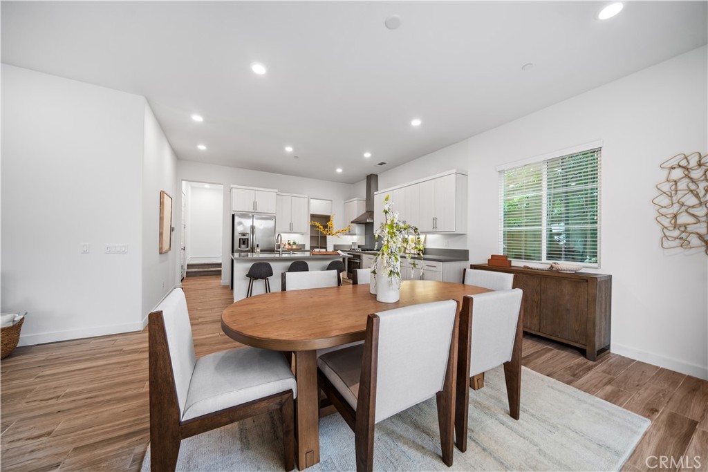 116 Newall Irvine, CA 92618 - Photo 9 of 45 a dining room with furniture and wooden floor
