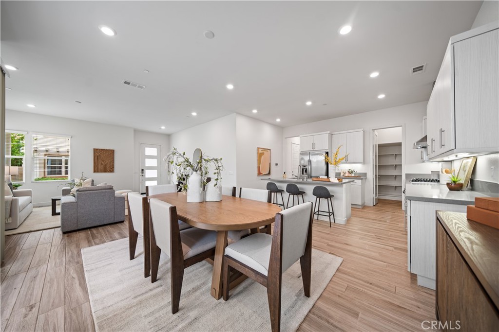 116 Newall Irvine, CA 92618 - Photo 10 of 45 a view of a dining room with furniture window and wooden floor