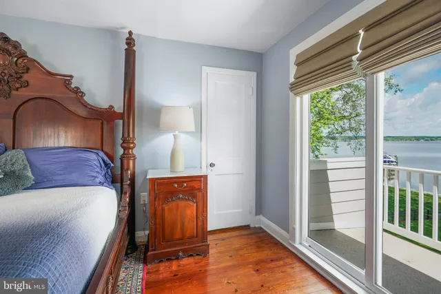 a living room with a balcony furniture and a window
