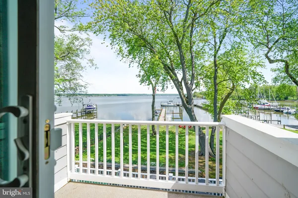 a view of a house with backyard and deck