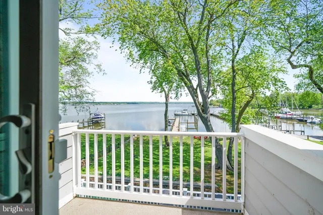 a view of a house with backyard and deck