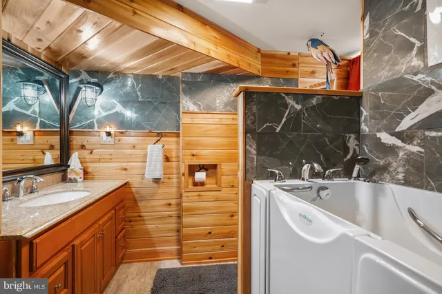 a kitchen with stainless steel appliances granite countertop a stove and a sink