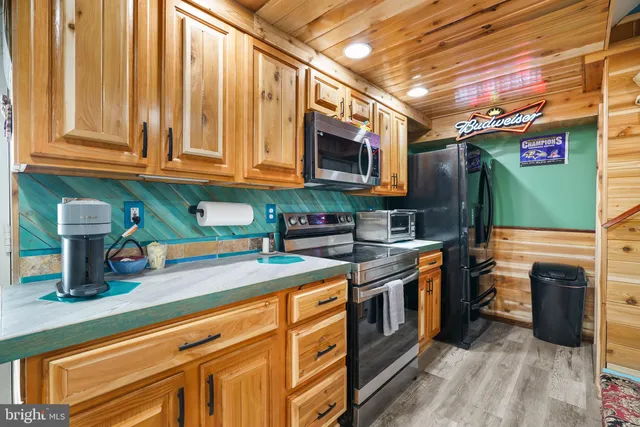 a balcony with table and chairs and potted plants