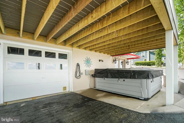 a double vanity in front of house with a yard and trees