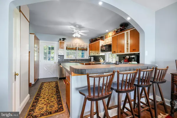 a dining room with furniture and window