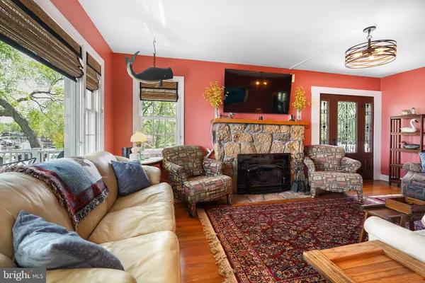 a living room with a fireplace furniture and a fireplace