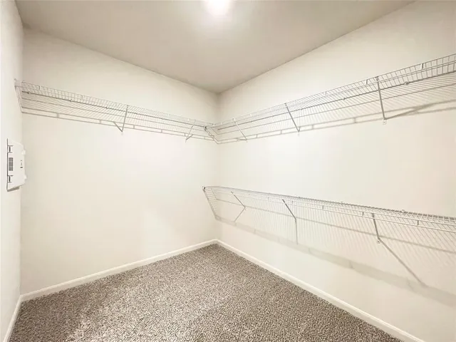 a view of a room with racks on the wall