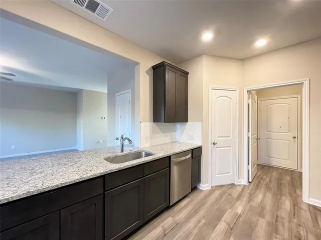 a bathroom with a double vanity sink and mirror