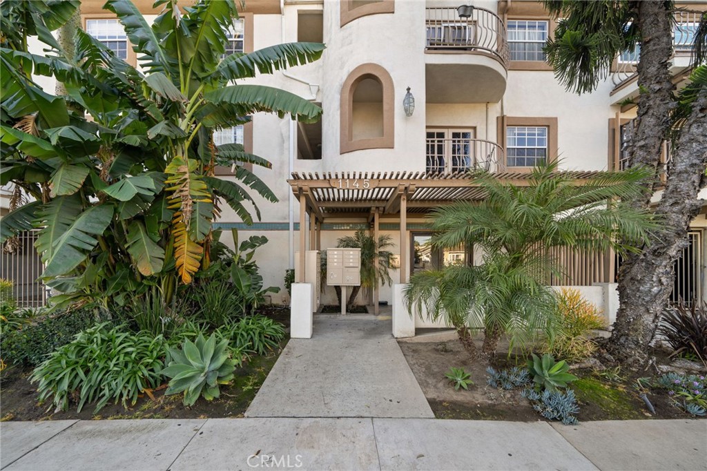 1145 Roswell Avenue, Unit 204 Long Beach, CA 90804 - Photo 2 of 14 a front view of a house with a garden