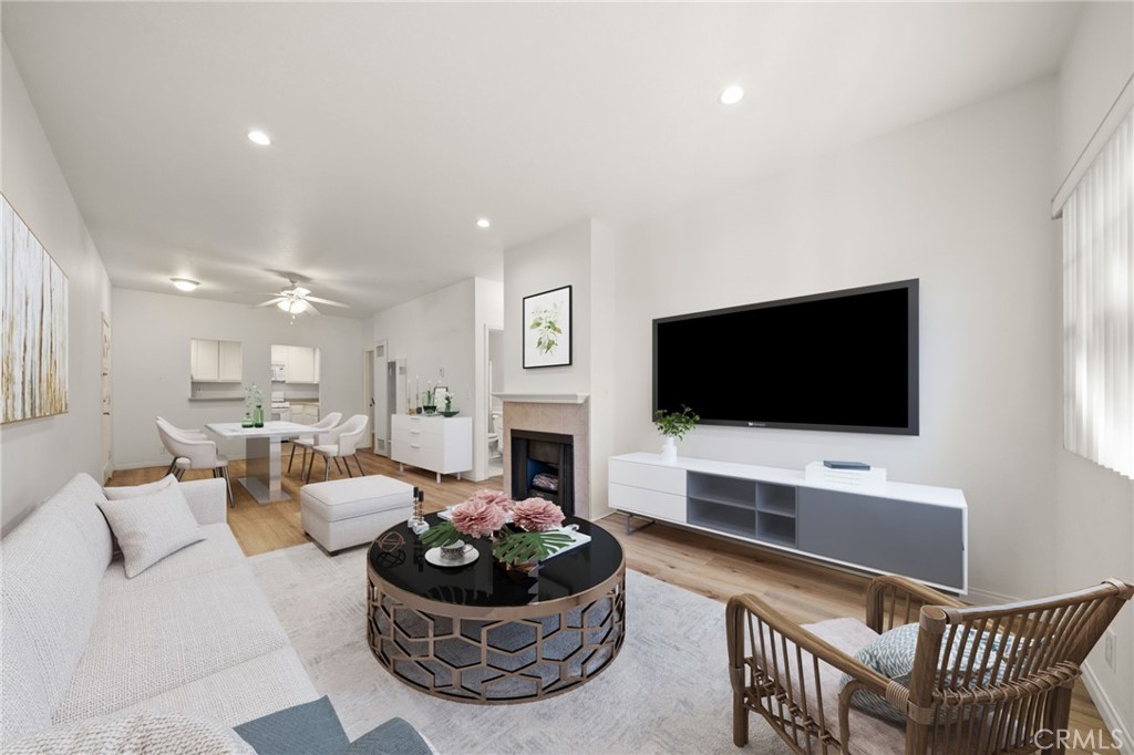 1145 Roswell Avenue, Unit 204 Long Beach, CA 90804 - Photo 5 of 14 a living room with furniture and a flat screen tv