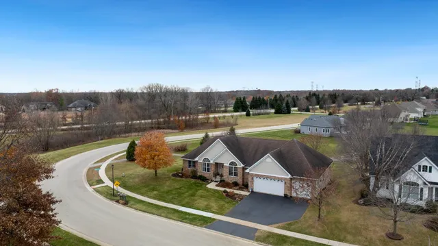 a view of a swimming pool with a yard
