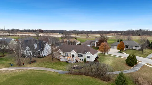 a view of a lake with houses in front of it