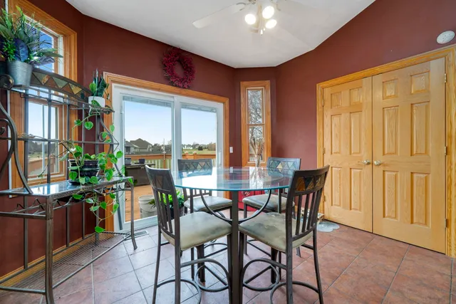 a view of a dining room with furniture window and outside view