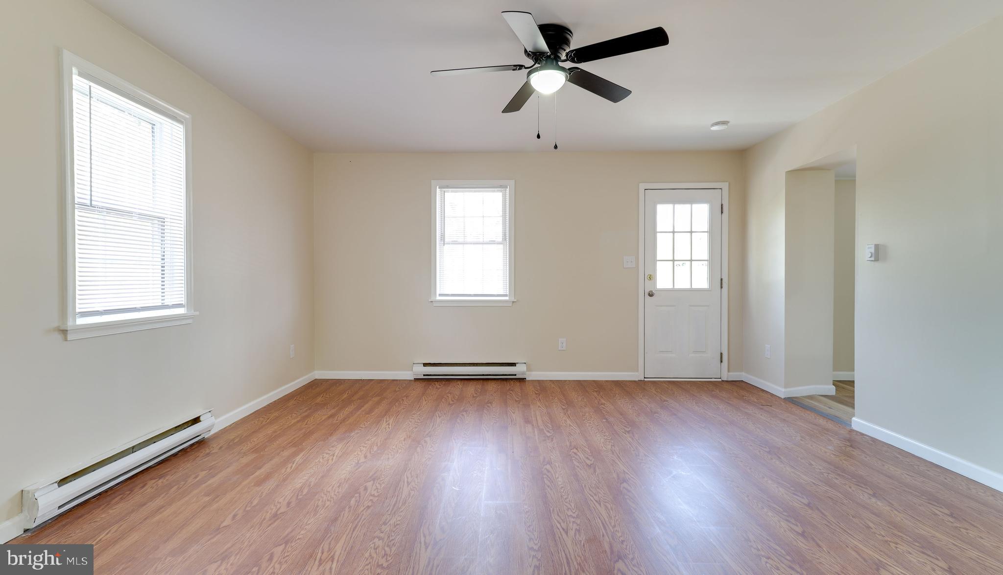 519 Back Neck Road Bridgeton, NJ 08302 - Photo 4 of 12 a view of empty room with wooden floor and fan