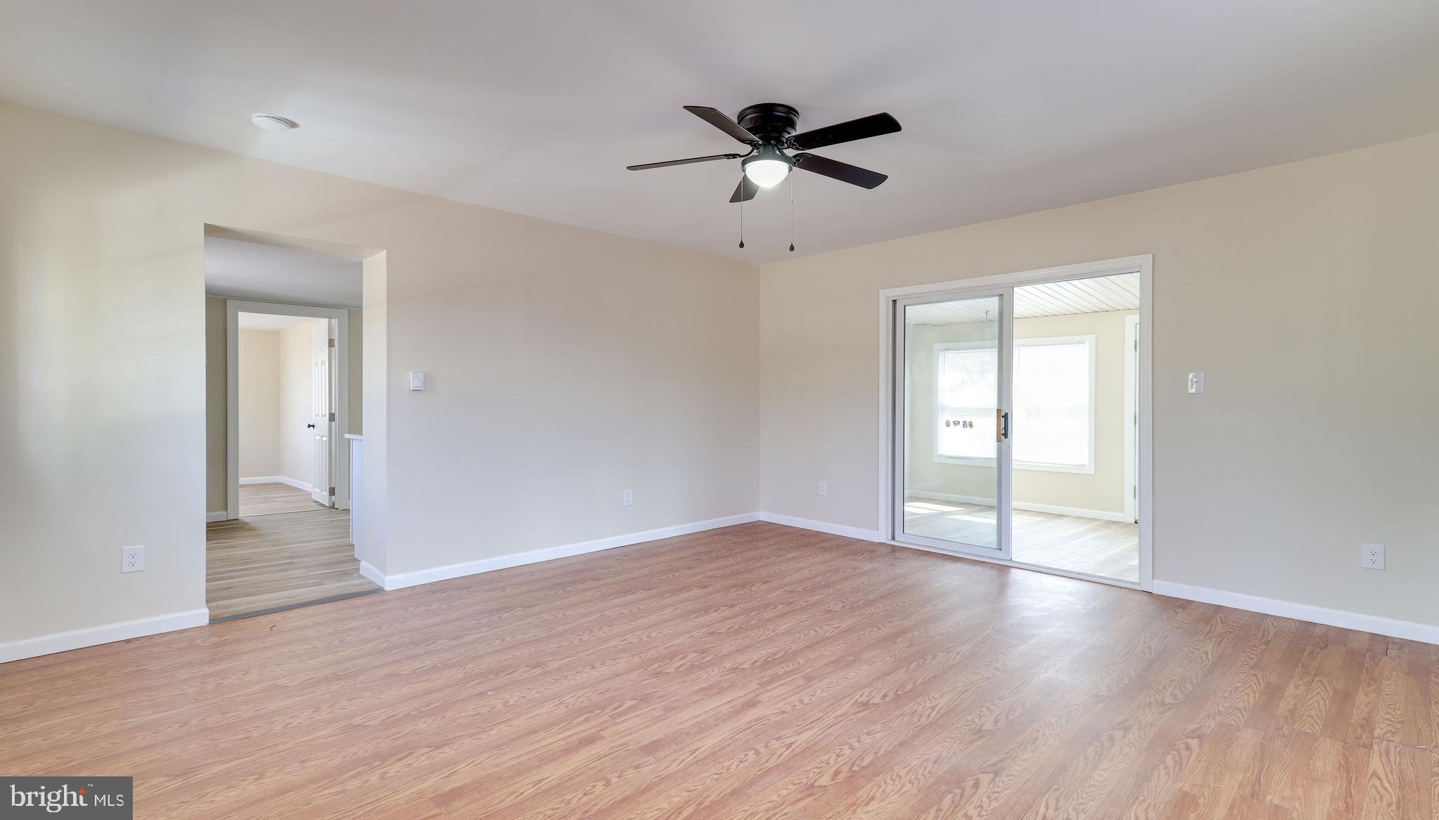 519 Back Neck Road Bridgeton, NJ 08302 - Photo 6 of 12 a view of an empty room and wooden floor