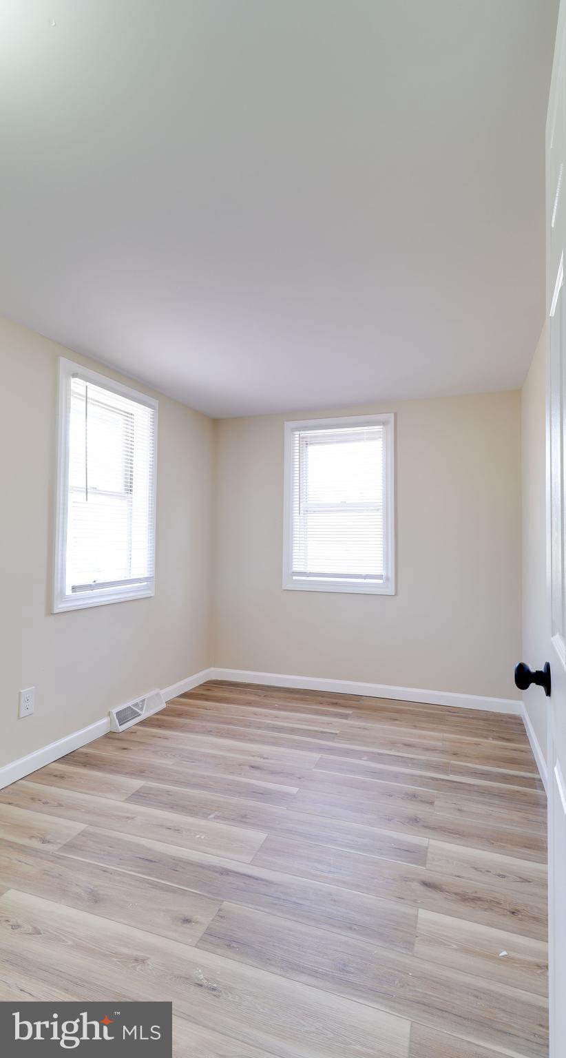 519 Back Neck Road Bridgeton, NJ 08302 - Photo 9 of 12 a view of an empty room with wooden floor and a window