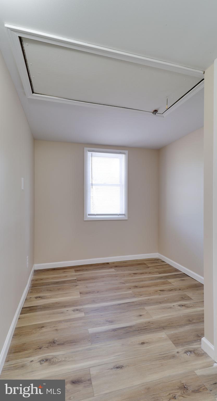 519 Back Neck Road Bridgeton, NJ 08302 - Photo 10 of 12 a view of an empty room with wooden floor and a window