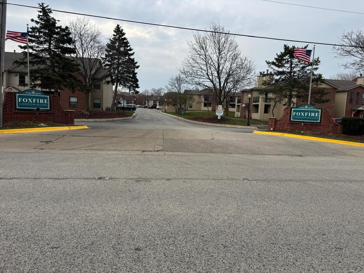 1935 North Hicks Road, Unit 106 Palatine, IL 60074 - Photo 2 of 16 a view of a building with a street