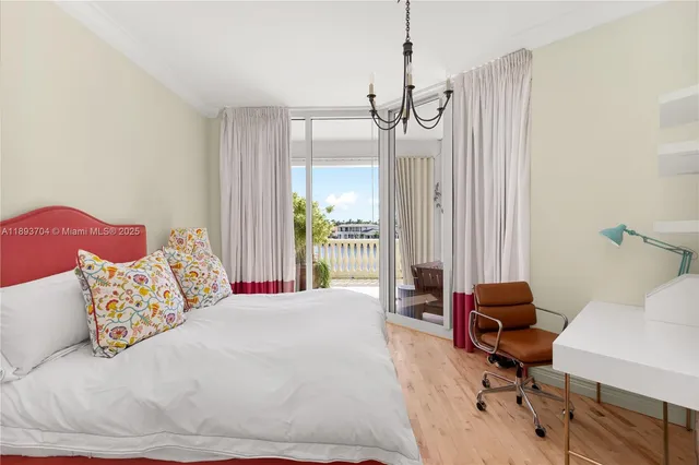 a bed room with a bed window and a chair