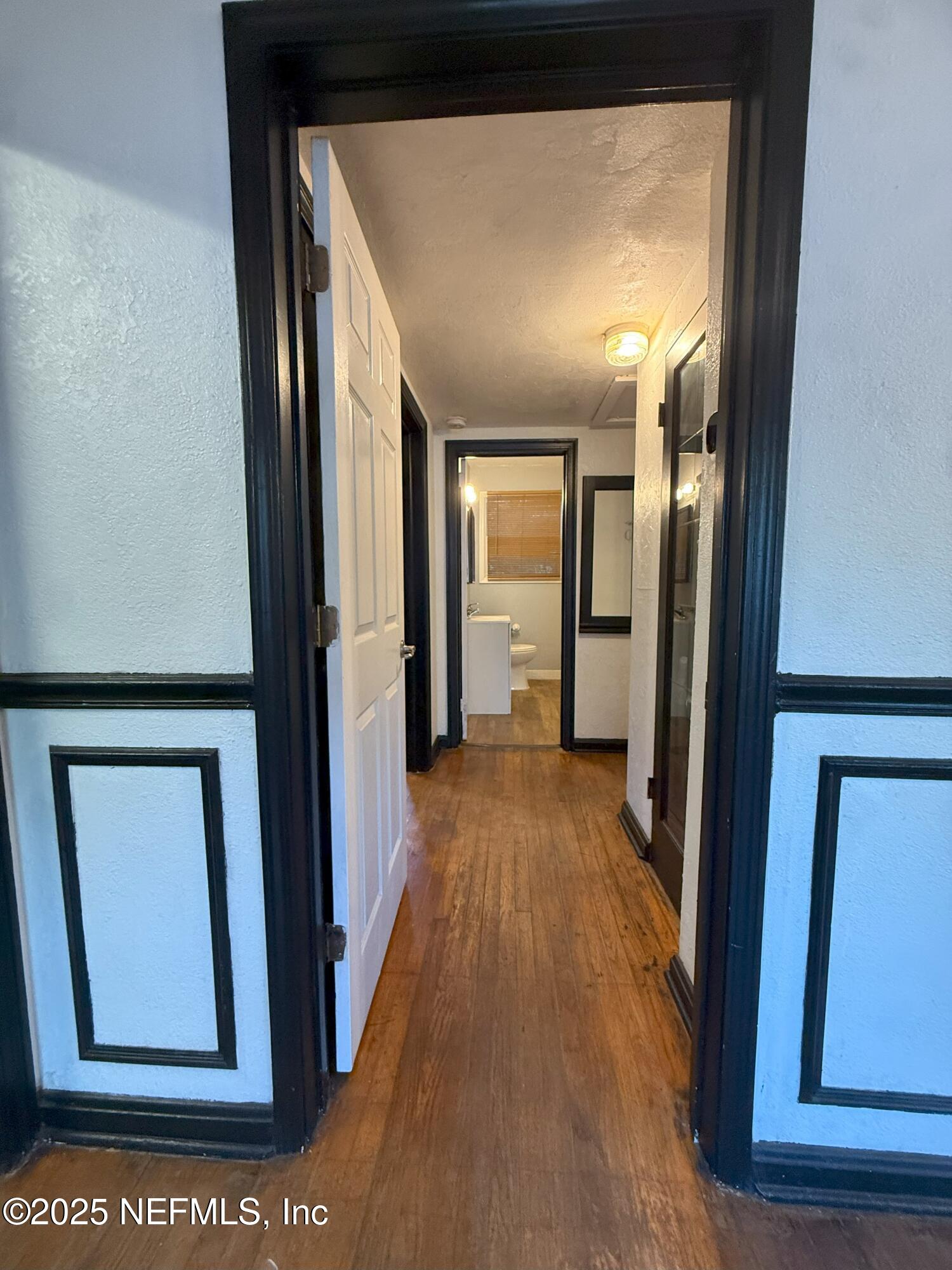 3546 Oleander Street Jacksonville, FL 32254 - Photo 11 of 32 a view of hallway with wooden floor