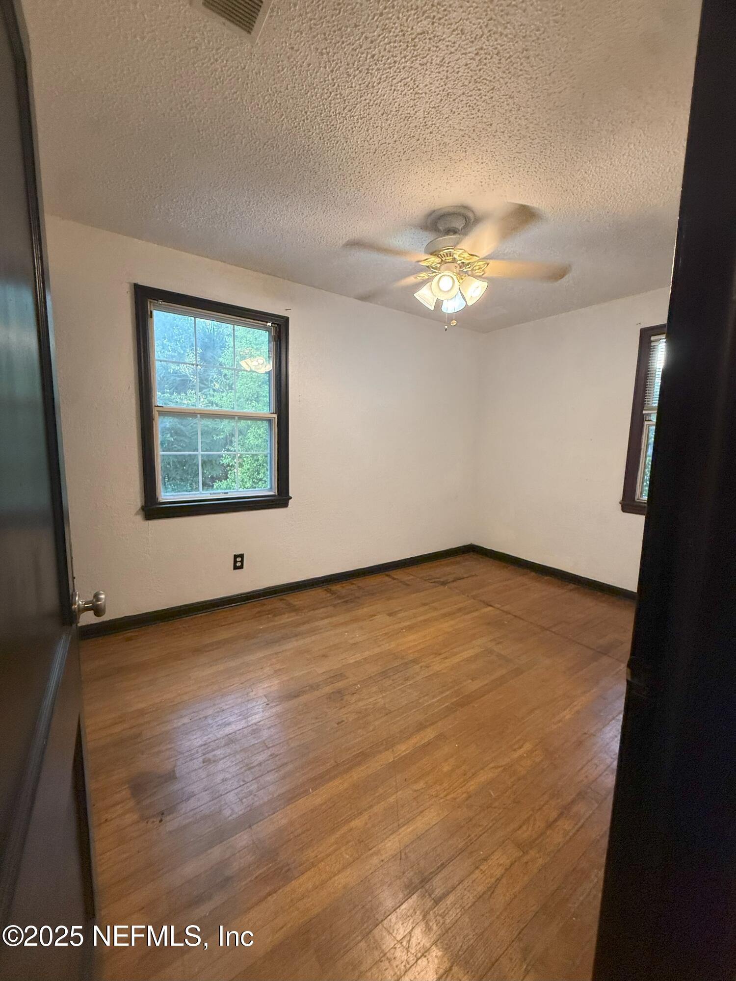 3546 Oleander Street Jacksonville, FL 32254 - Photo 12 of 32 a view of a room window and a ceiling fan