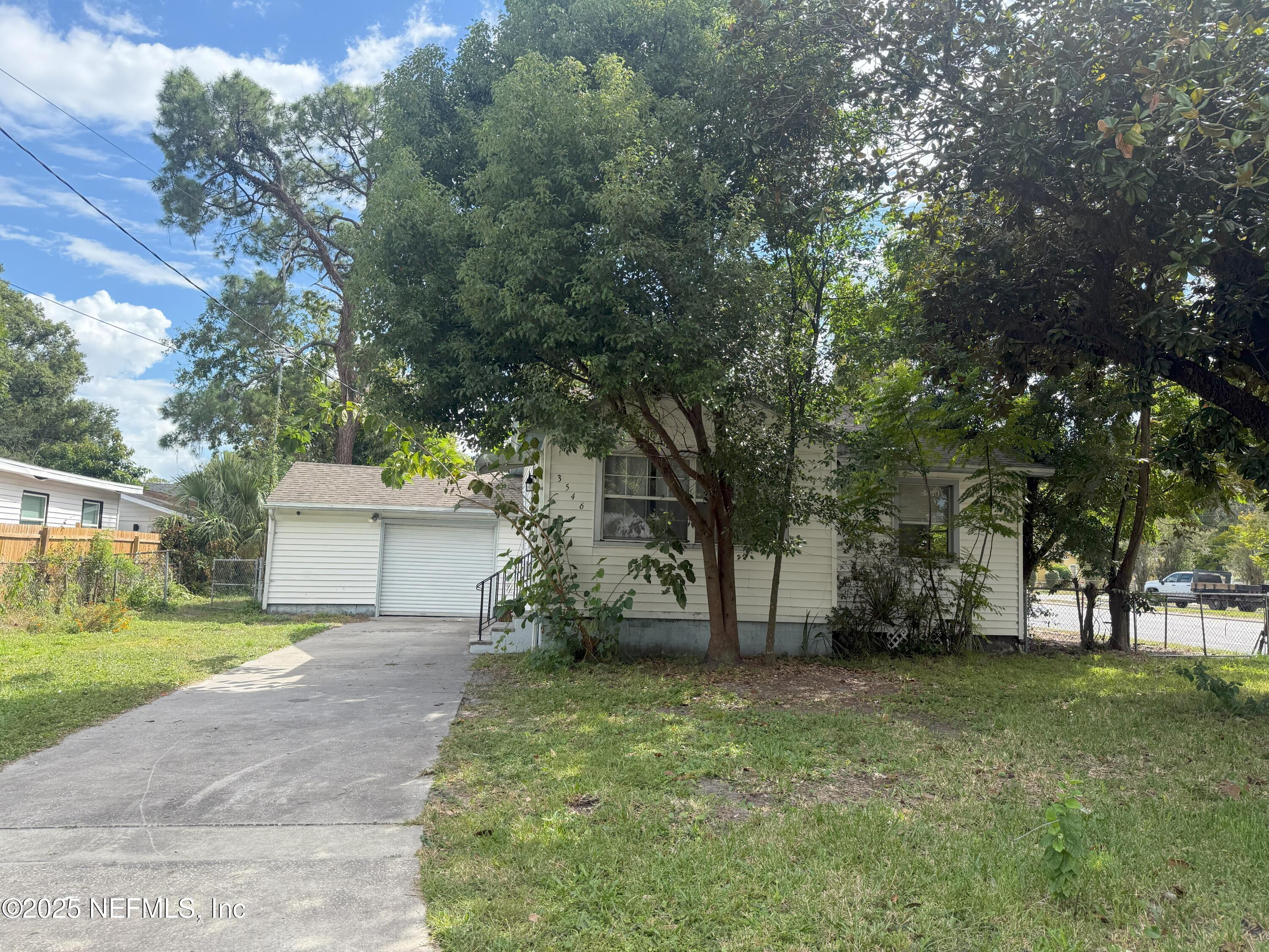 3546 Oleander Street Jacksonville, FL 32254 - Photo 2 of 32 a view of a backyard with large trees