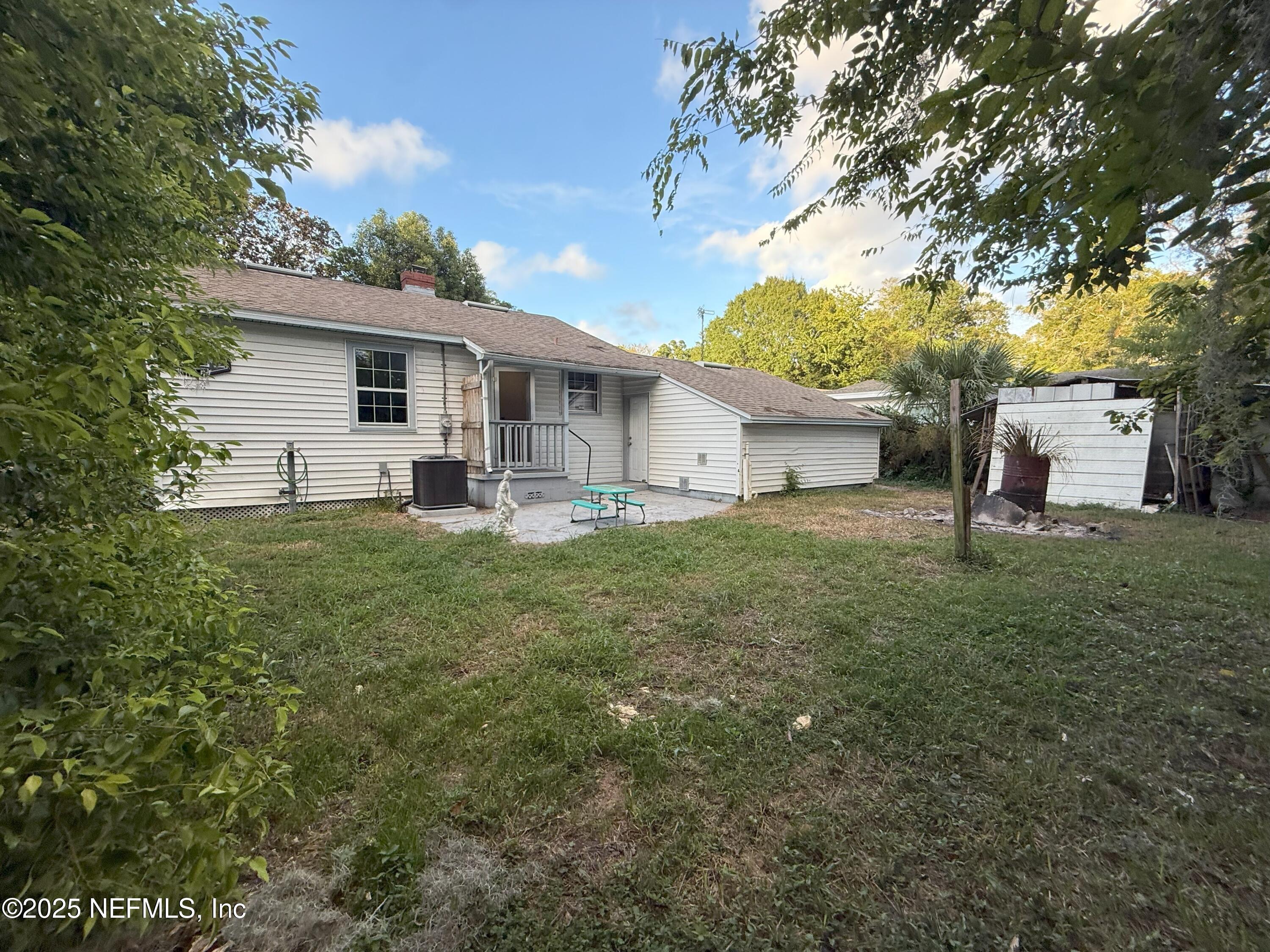 3546 Oleander Street Jacksonville, FL 32254 - Photo 22 of 32 a front view of house with yard and trees