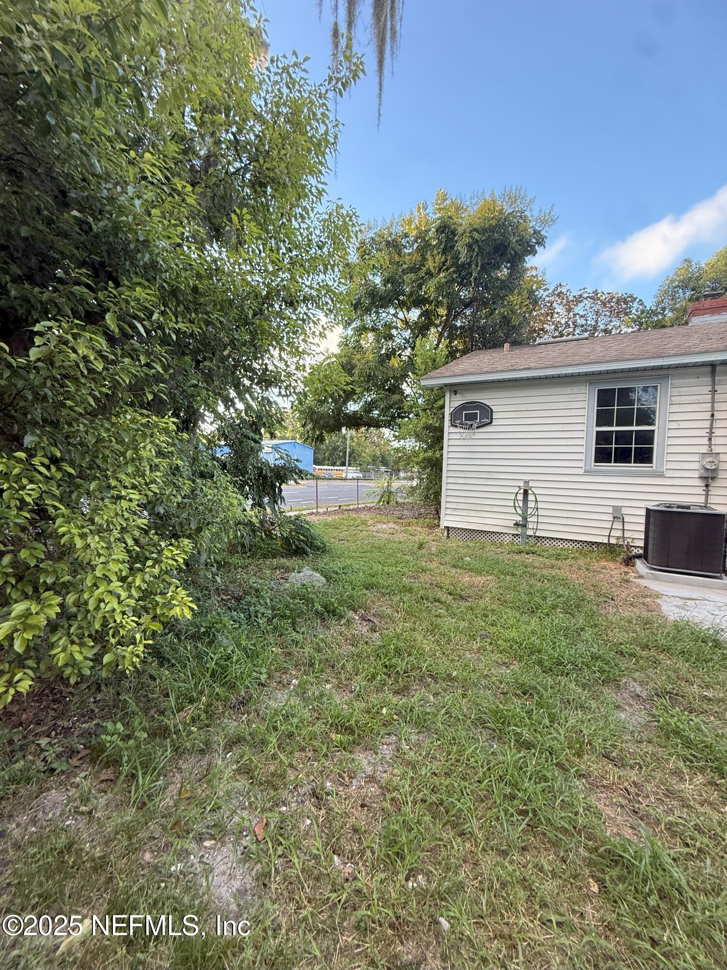 3546 Oleander Street Jacksonville, FL 32254 - Photo 23 of 32 a view of a backyard with large trees