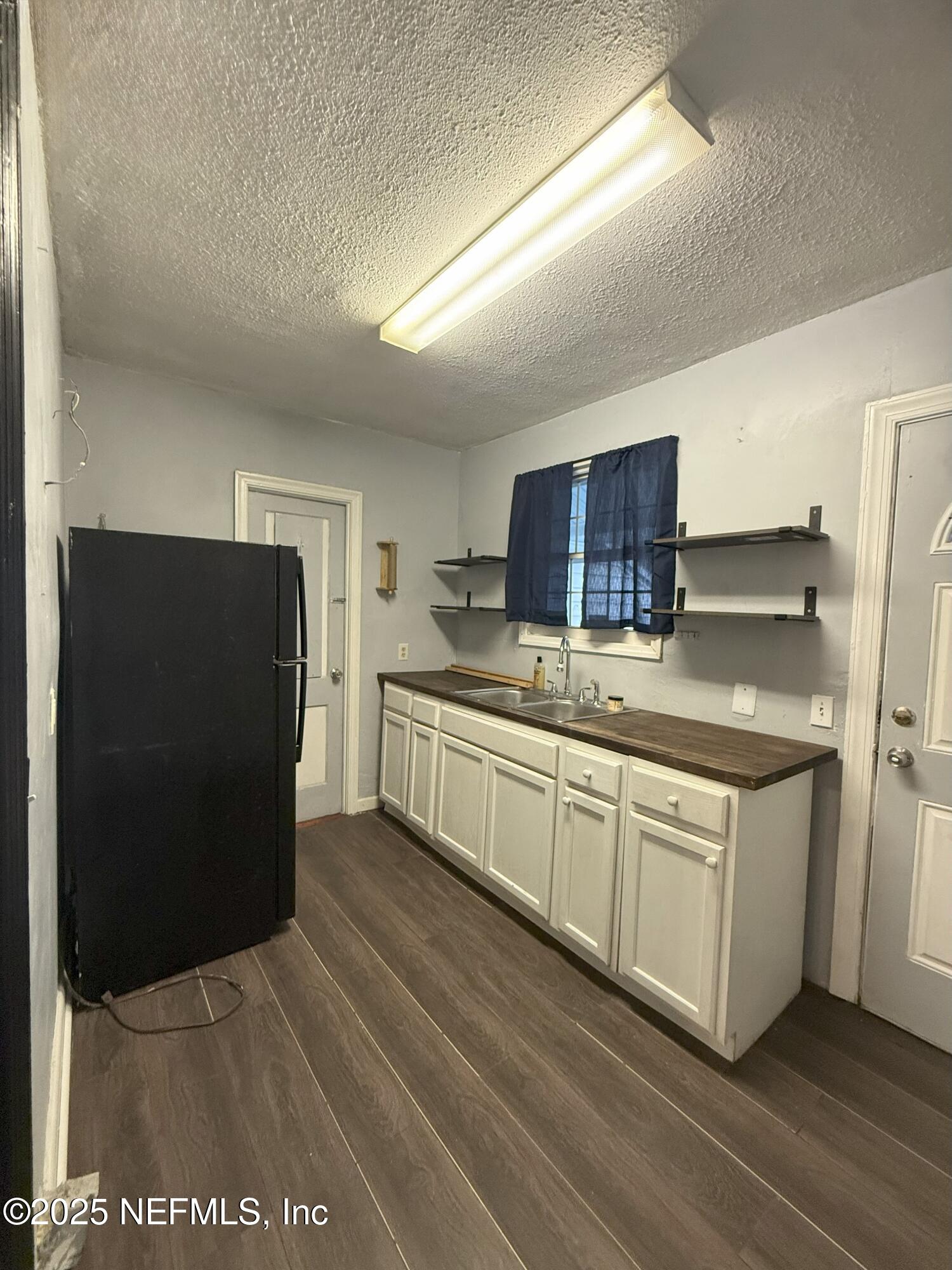 3546 Oleander Street Jacksonville, FL 32254 - Photo 9 of 32 a kitchen with stainless steel appliances granite countertop a refrigerator and a stove