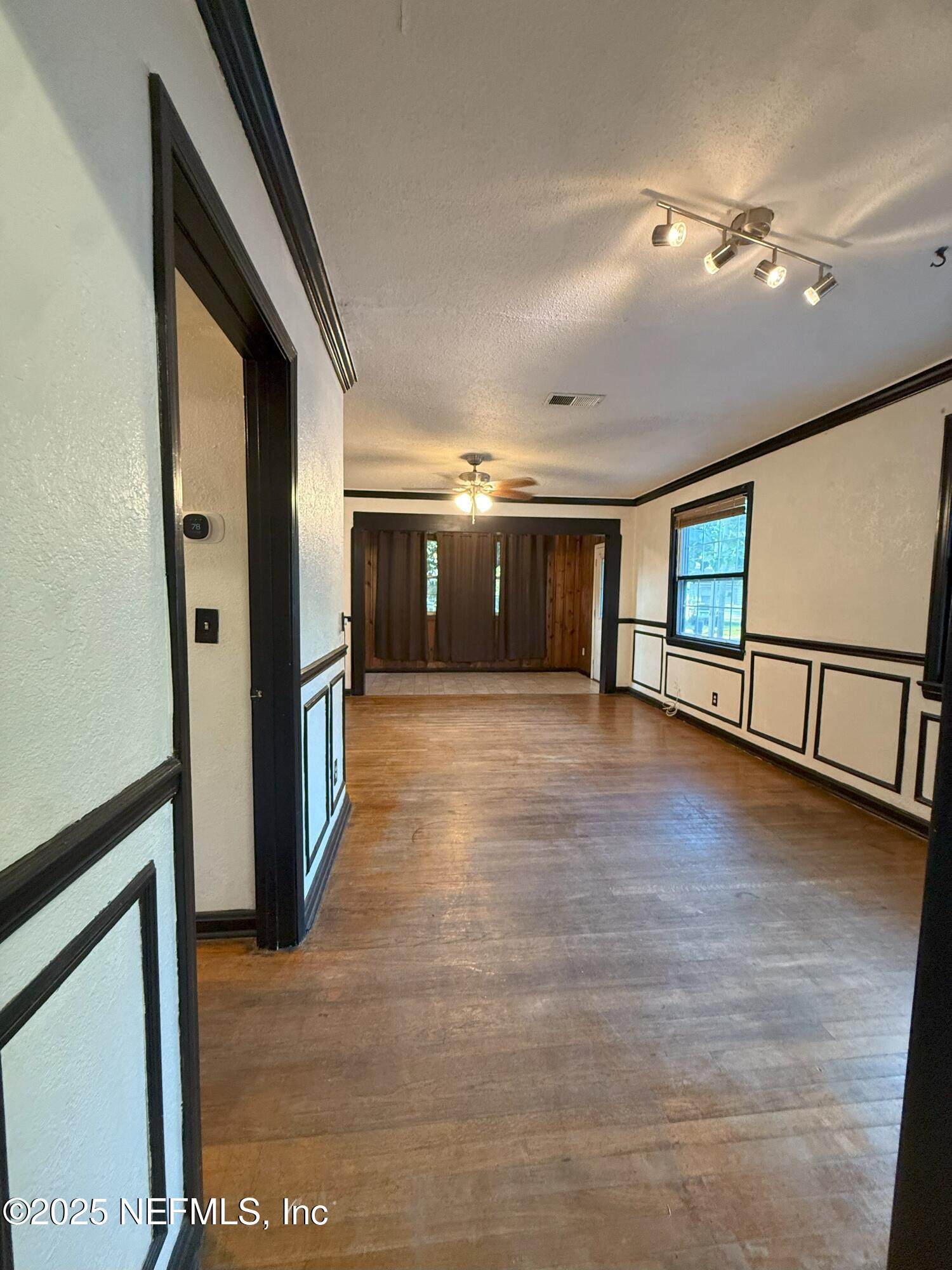 3546 Oleander Street Jacksonville, FL 32254 - Photo 10 of 32 a view of a hallway with wooden floor