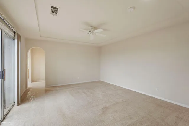 a view of balcony with wooden floor and fence