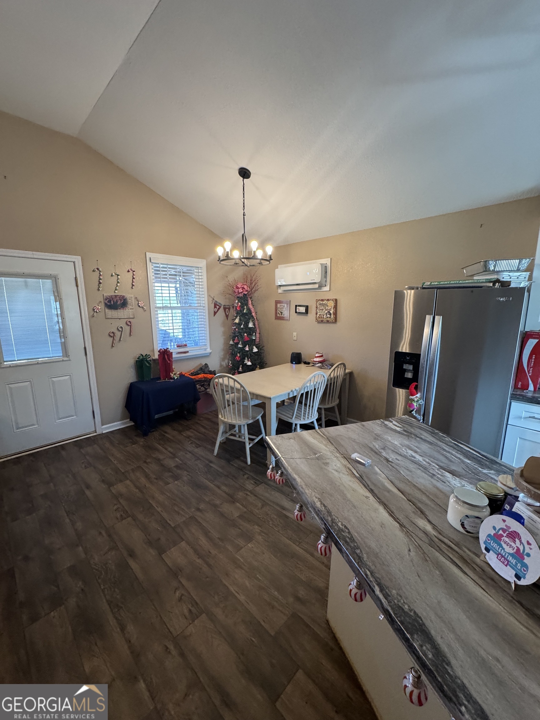 353 Mosley Road Vidalia, GA 30474 - Photo 13 of 14 a living room with furniture and a chandelier