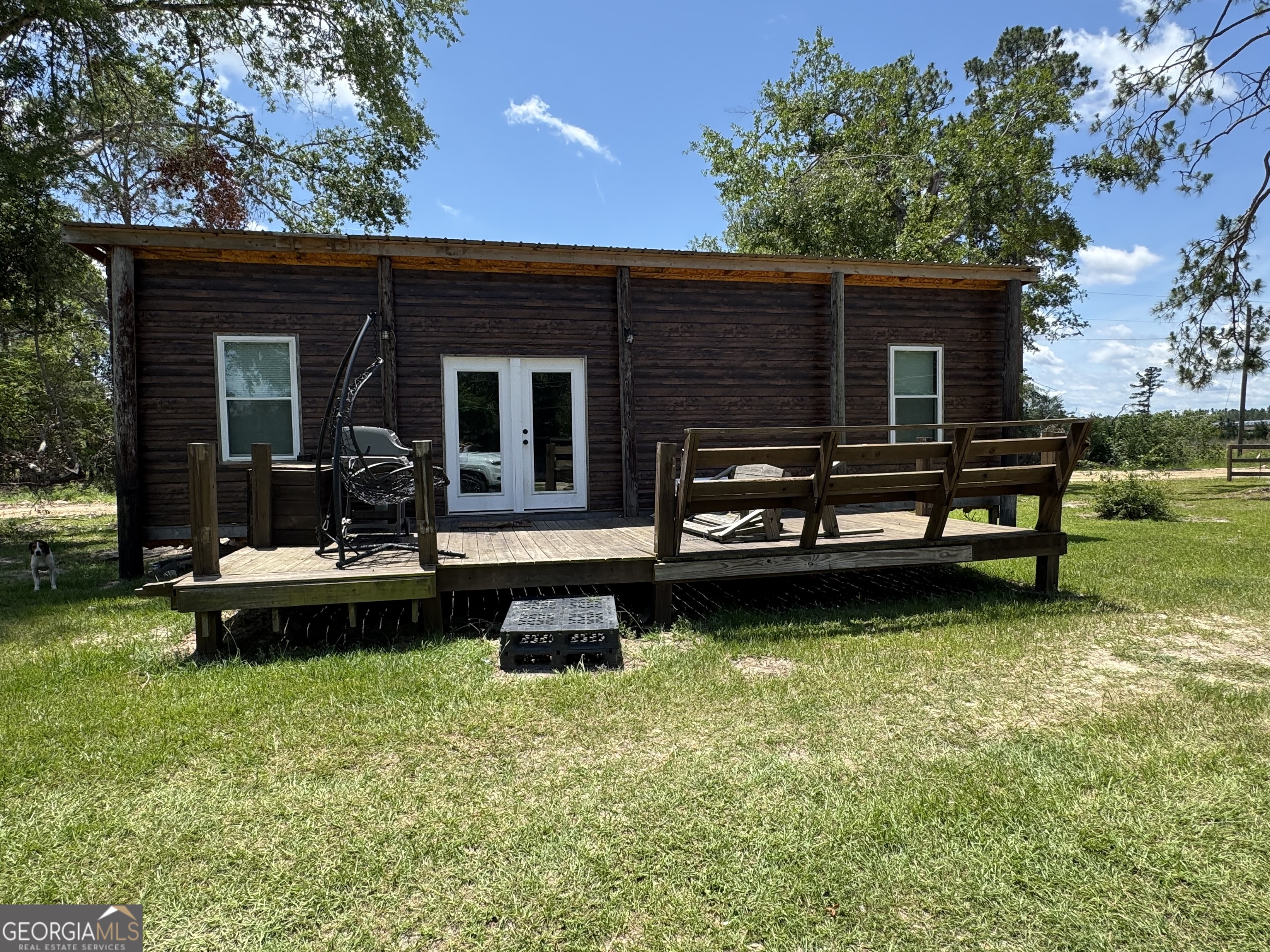 353 Mosley Road Vidalia, GA 30474 - Photo 3 of 14 a view of a house with swimming pool in front of a yard