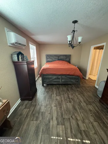 a bed sitting in a room next to a window