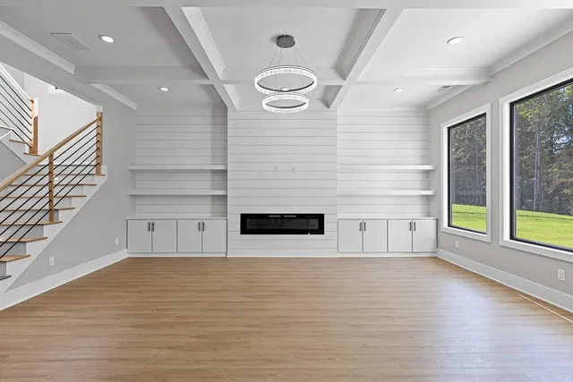 a view of kitchen with kitchen island and stainless steel appliances