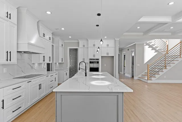 a kitchen with a stove and a sink