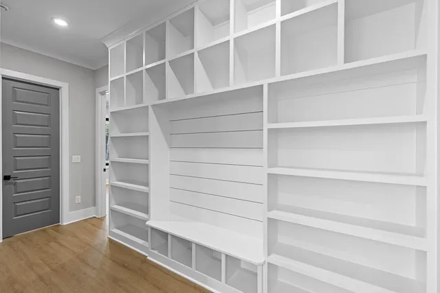 a bathroom with a toilet a sink and a mirror