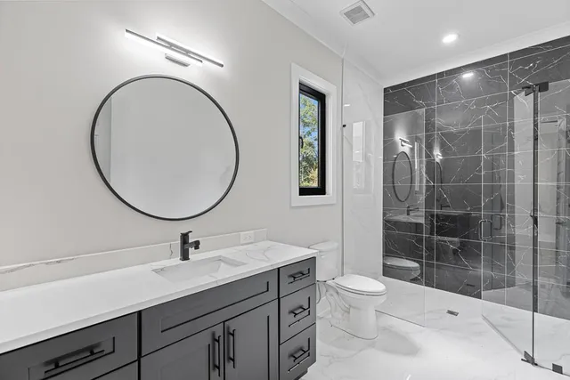 a view of a livingroom with a ceiling fan window and a fireplace