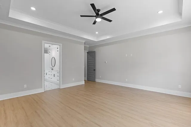 a bathroom with a double vanity sink mirror and bathtub