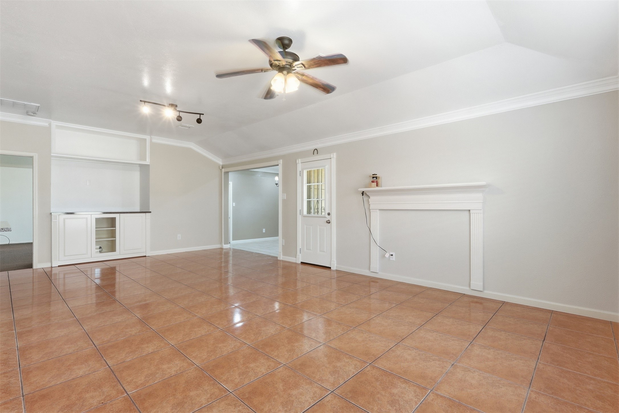 12638 Coho Lane Houston, TX 77045 - Photo 12 of 29 a view of an empty room with a ceiling fan