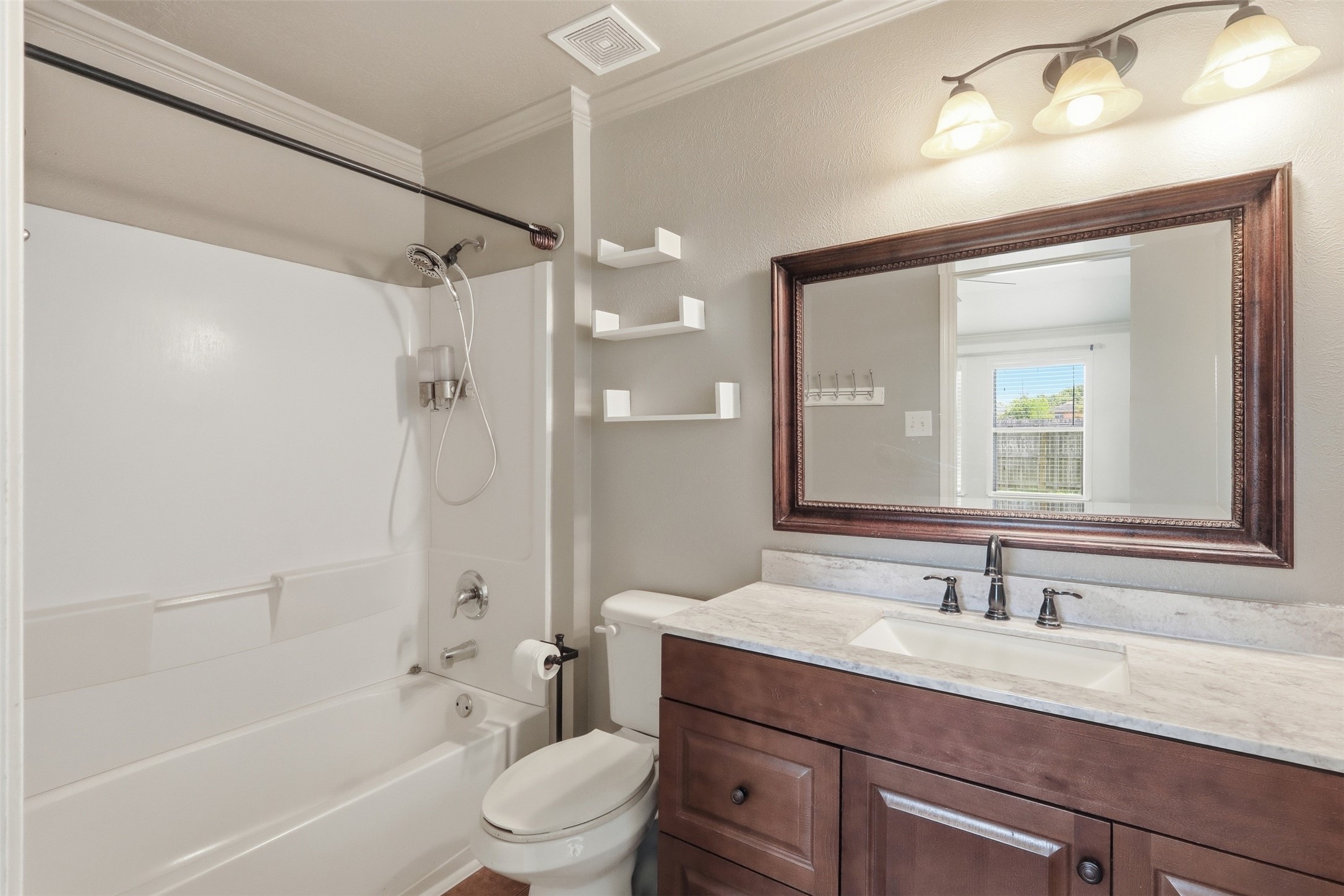 12638 Coho Lane Houston, TX 77045 - Photo 20 of 29 a bathroom with a granite countertop sink a toilet and shower
