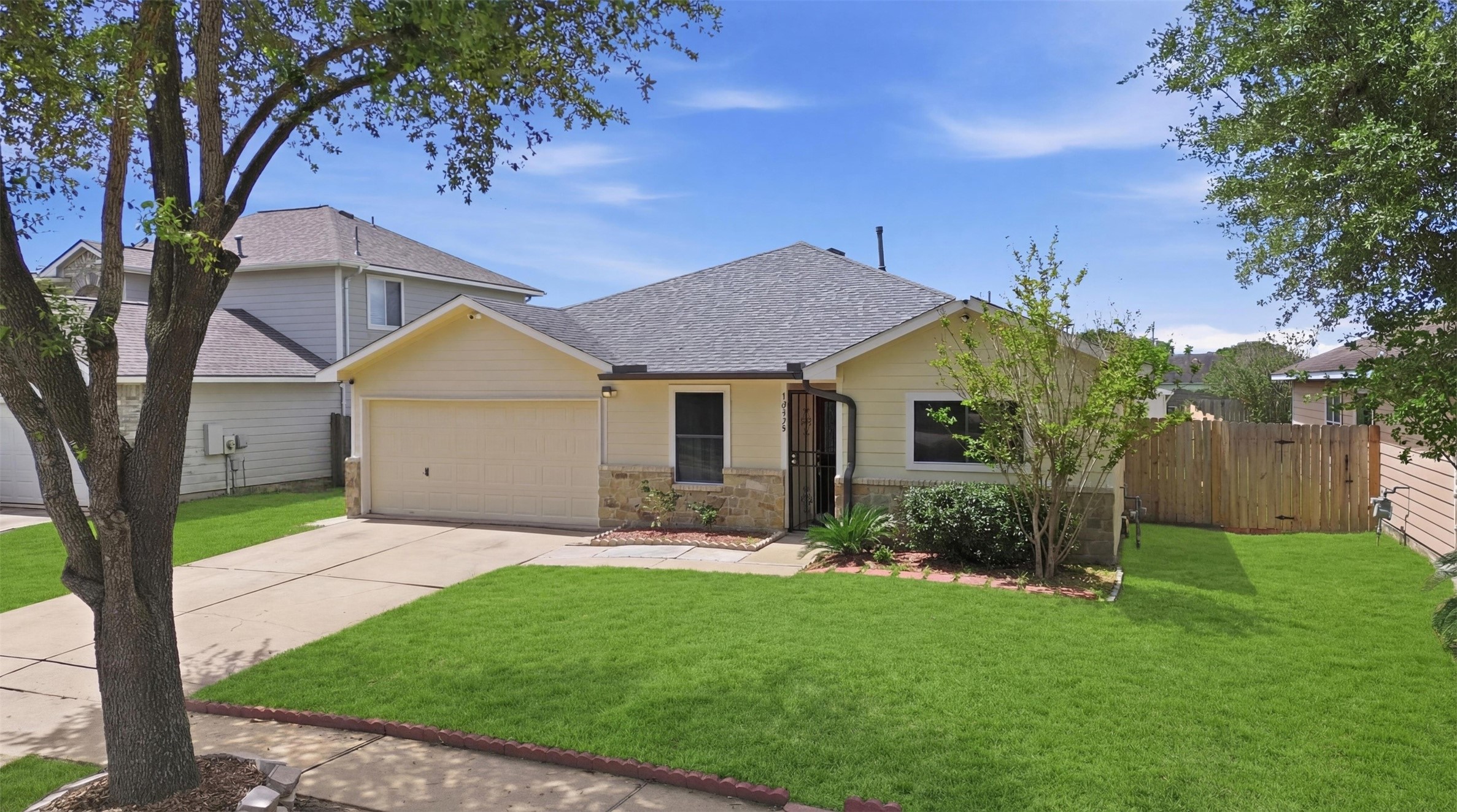 12638 Coho Lane Houston, TX 77045 - Photo 25 of 29 a front view of house with yard and green space
