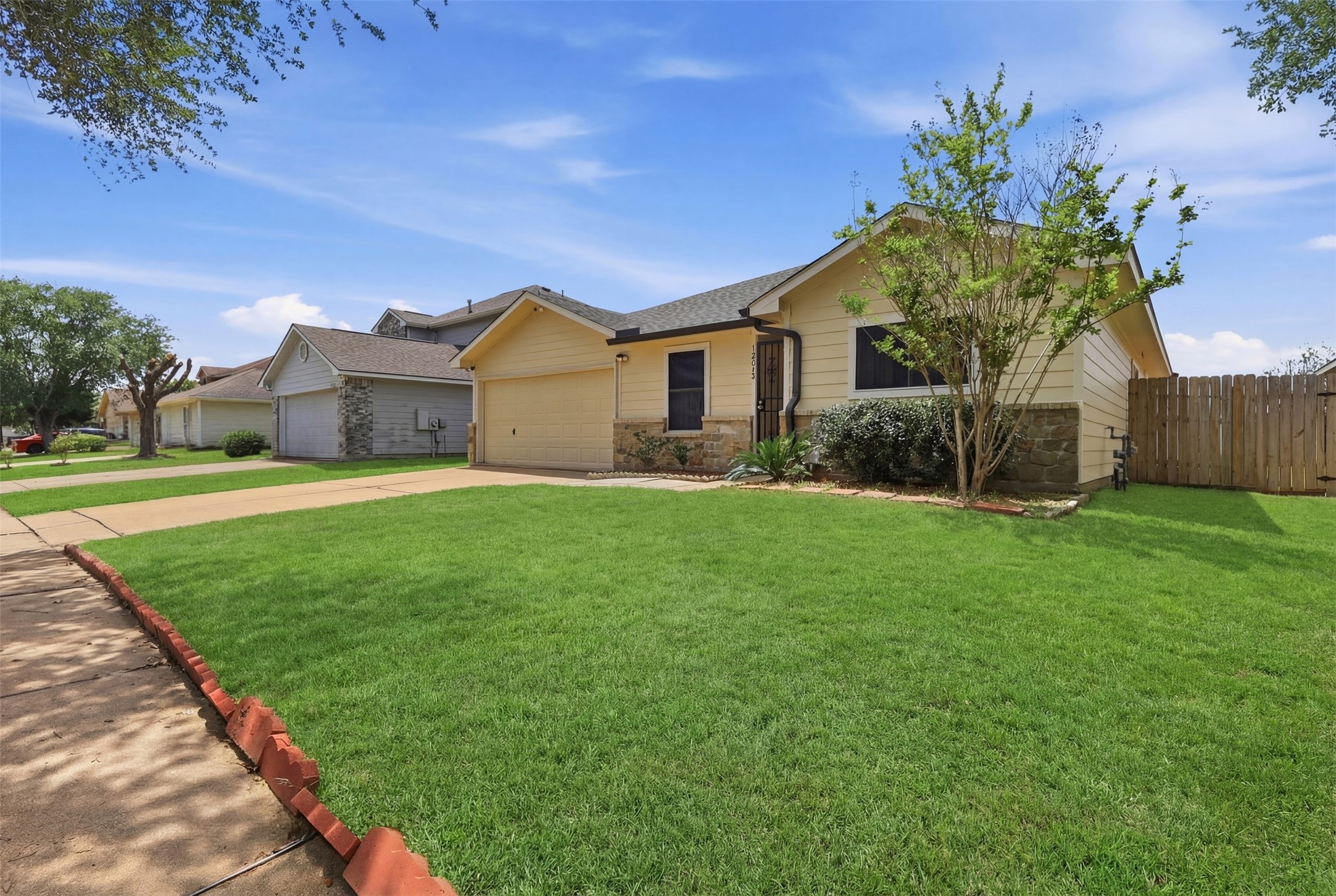 12638 Coho Lane Houston, TX 77045 - Photo 26 of 29 a front view of house with yard and green space
