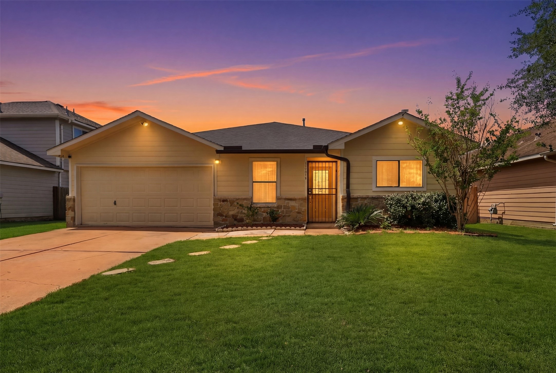 12638 Coho Lane Houston, TX 77045 - Photo 28 of 29 a front view of a house with a yard and garage