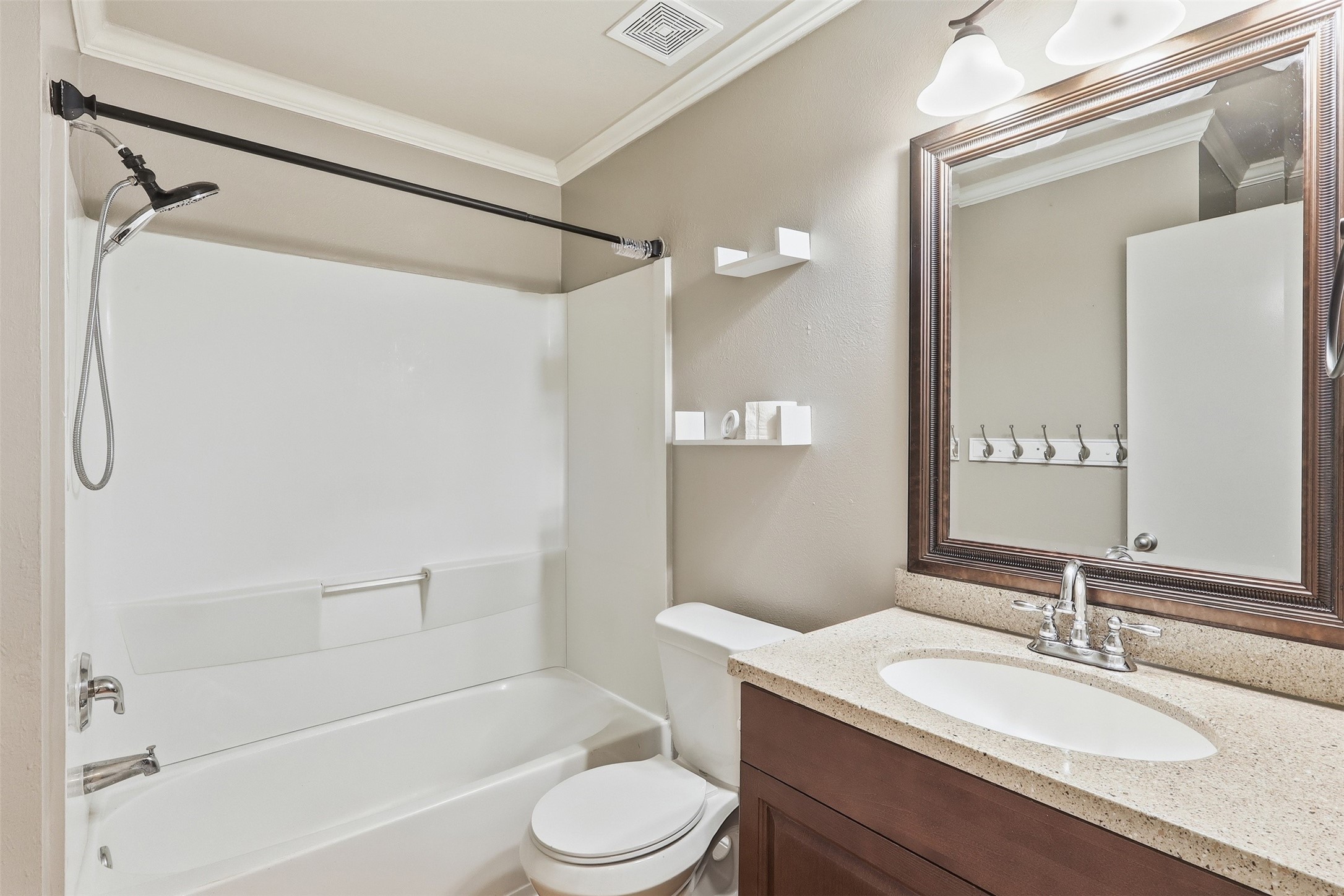 12638 Coho Lane Houston, TX 77045 - Photo 7 of 29 a bathroom with a granite countertop sink toilet and shower