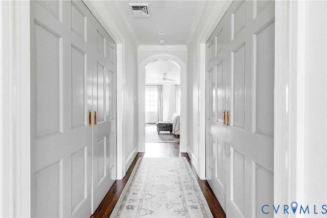 6 Berkshire Road Richmond, VA 23221 - Photo 42 of 66 a view of a hallway with windows and a chandelier